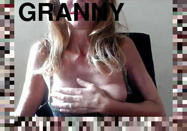 Granny in glasses on webcam