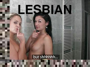 Two lesbian babes with small tits make each other cum in the bathroom