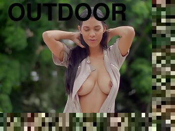 Solo model Kendra Roll In outdoors playing with her round boobs