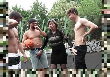 Dirty granny gets fucked on the basketball court by a lot of dudes