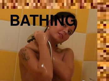 Irresistible chick with nice tits gets spied on while she is having a shower