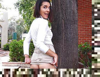 Naughty brunette teen Miki exposes her perky ass in public