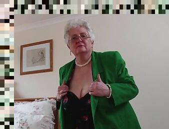 Amateur mature granny Caroline V. plays with her huge tits