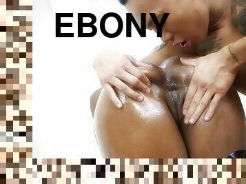 Oiled up ebony babe Sinnamon Love gets her huge ass covered with cum