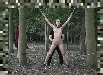 Sexy slave tied up to a tree and tortured