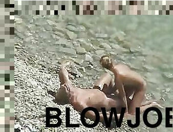 Sexy Blonde Babe Gives her Boyfriend a Blowjob on a Beach