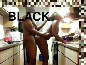 Black amateur couple goes for a quick doggy fuck in the kitchen