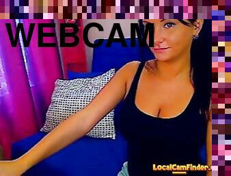 Hot brunette with hot tits stripteasing on webcam