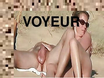 Voyeur Porn Video of a Mature Babe Giving a Handjob on the Beach