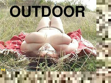 Outdoor shoot of big tits mature amateur dame giving out blowjob