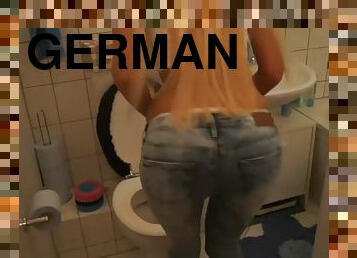 German mature blonde sucking dick in a bathroom