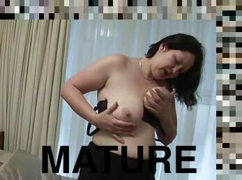 Buxom matured babe showcasing her big tits then masturbating