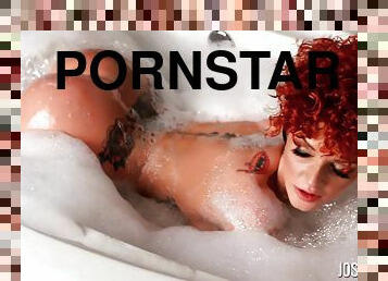 Redhead Joslyn James displaying her nice ass while taking bath
