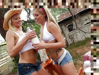 Hot and messy lesbians fucking their anals outdoors with a strap on