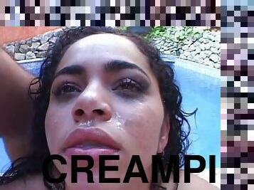 Wavy haired pornstar gets a creampie facial after being gang banged