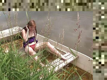 Hot lady masturbates on a boat in naked