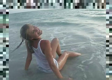 Amateur blonde teen naively poses in Wet T-shirt on the beach