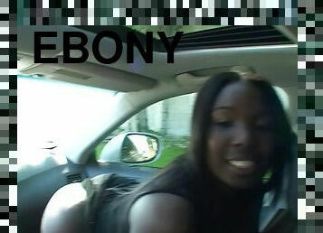 Refined ebony babe with long hair gets her face fucked in the car