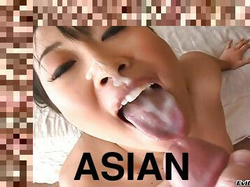 An adorable Asian girl uses her mouth and hands to make a guy cum