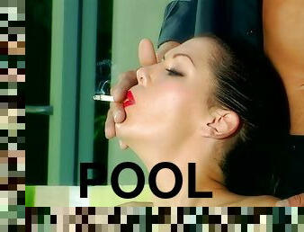 Vivacious porn star with long dark hair enjoying a hardcore fuck next to her pool