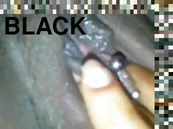 Kinky black chick fingers her soaking wet pierced twat