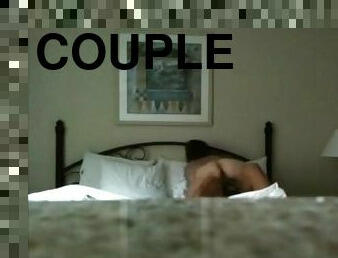 Homemade sex tape with a couple fucking in cowgirl pose on a bed