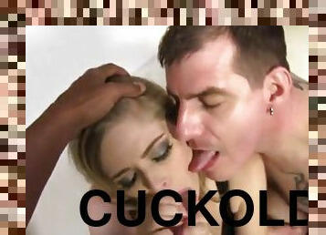 A cuckolded guy sucks a dildo while his wife gets fucked