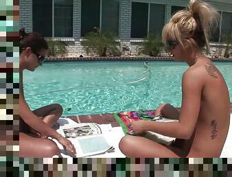 Two hot girls hang out naked by the pool and relax