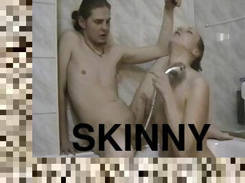 Skinny dude gets his long cock sucked by his GF in the shower