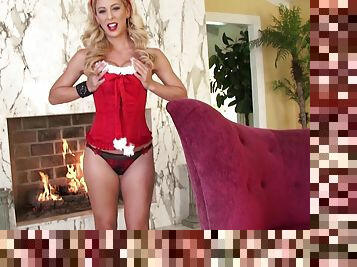 Sexy blonde Santa girl Cherie Deville satisfies herself with fingering