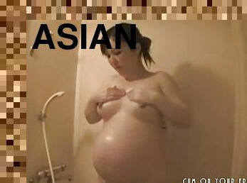 Pregnant Asian Brunette Taking A Bath