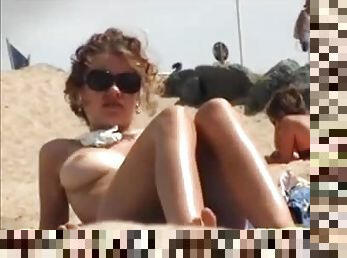 Two Topless Chicks On The Beach