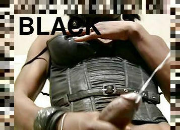 Black leather lingerie looks amazing on the black tranny
