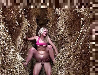 Farm girl gets fucked by one of the ranch hands behind some hay