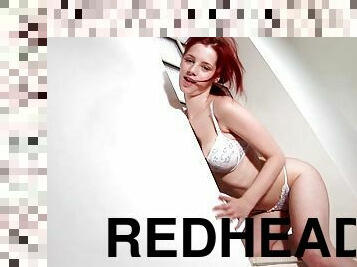 Fashionable redheaded babe strips off all her clothes