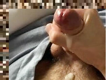 hairy guy jerks off in his bed and cums on himself