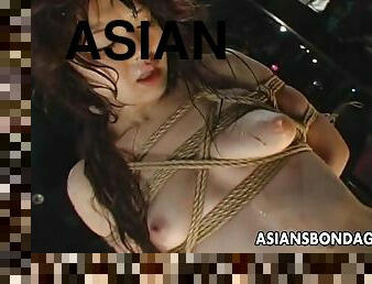 Asian sex slave with big boobs being tortured by a stranger