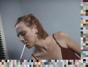 Ugly mature slut smokes a cigarette and shows her body