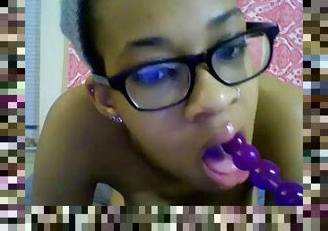 Exotic girl with glasses fucks her pussy with a small dildo