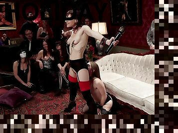 Alice March and Audrey Holiday are among the subs at a BDSM party