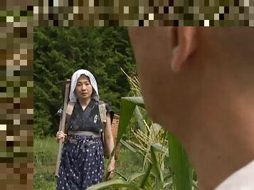 Mature Japanese woman with nice big tits enjoying a hardcore fuck in a field