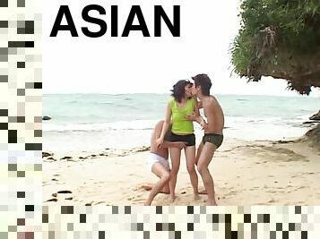 Asian milf gets double teamed by two hung studs on the beach
