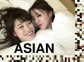 Lovely Asian lesbians celebrate their glowing sex life in bed