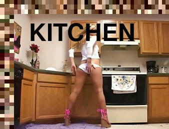 Salacious cowgirl in hot panties poses seductively in the kitchen