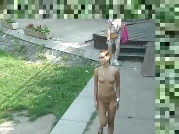 Naked girl with small tits walks the park