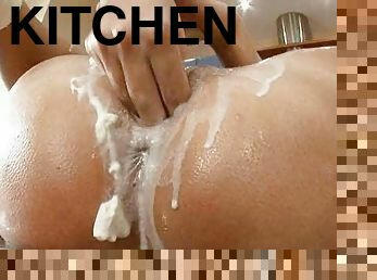 Dildoing with insanely huge dildo in a kitchen