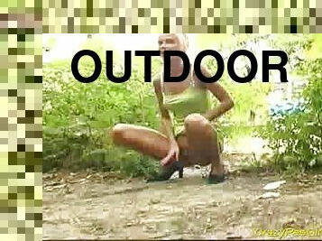 Crazy pee girl outdoor action