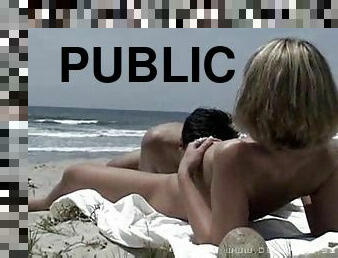 Having sex on the beach with people watching