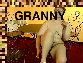 Horny granny Julie is fingering herself hard