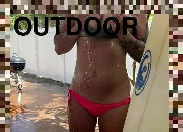 Katie from Katie's World Showering Outdoors After Daytona Beach Surfing